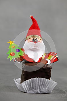A paper plate with a figure of Santa Claus or Nicholas