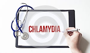 Paper plate with text CHLAMYDIA and doctor hand, medical concept