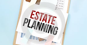 Paper plate with text Estate Planning. Diagram, notepad and blue background