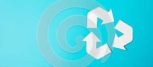 Paper Recycle logo cutout on blue background. Environmental Protection, Zero waste, Reusable, Say No Plastic, World Environment