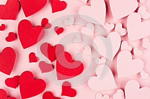 Paper red and pink hearts as male and female symbol soar on soft pink color background. Valentine day concept for design.