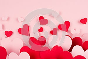 Paper red and pink hearts with blur perspective on soft pink color background. Valentine day concept for design.