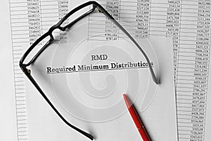 Paper with Required Minimum Distributions RMD on a table
