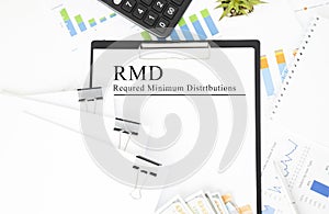 Paper with Required Minimum Distributions RMD on a table photo