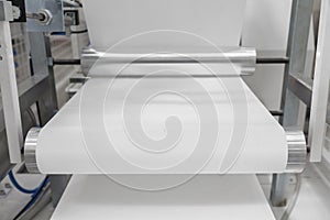 Paper rolling machine