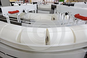 Paper rolls on conveyor