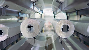 Paper rolls are moving inside of the industrial machine