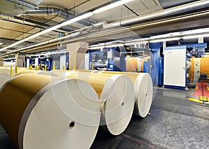 Paper rolls and offset printing machines in a large print shop f