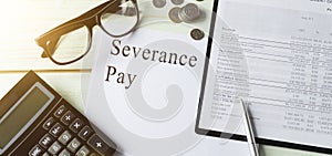 Paper with Severance Pay on a table