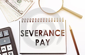 Paper with Severance Pay on a table. Business concept