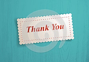 Paper sheet memo Thank You words on it over wooden background vector realistic illustration.