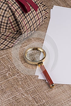 Paper sheets and magnifying glass