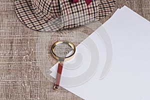 Paper sheets and magnifying glass