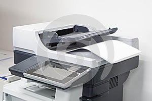 Paper sheets on the printer in office