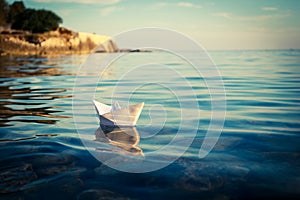 Paper Ship Floating in the Sea. Toned Photo.