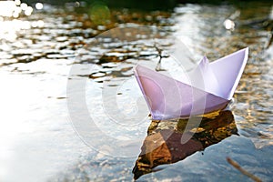 Paper ship in the lake