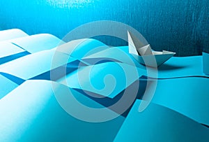 Paper ship in the paper sea. Concept of the theme of bureaucracy