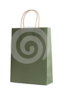 Paper shopping bag mockup template isolated on white background. Green color. Packet for gift or present.