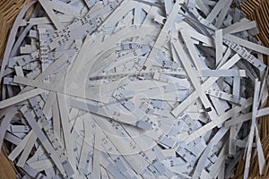 Paper shredder has shredded files - close-up