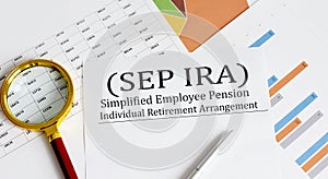 Paper with Simplified Employee Pension Individual Retirement Arrangement SEP IRA on a chart