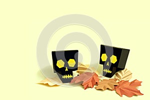 Paper skulls with autumn leaves