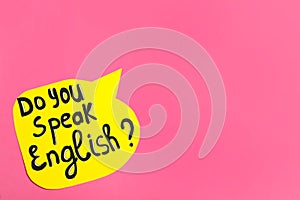 Paper speech bubble with question Do You Speak English on pink background, top view. Space for text