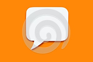 Paper speech bubble in the shape of a rectangle on a orange background