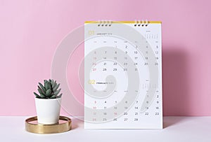 Paper spiral calendar year 2019 on pink background
