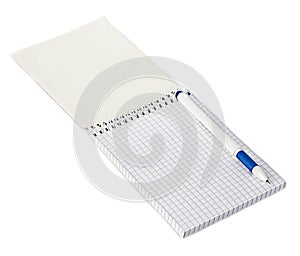 Paper spiral notebook with a pen close-up isolated on a white background. Blank background.
