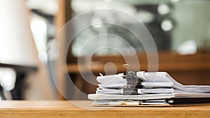 Paper stack on the desk related to business functions