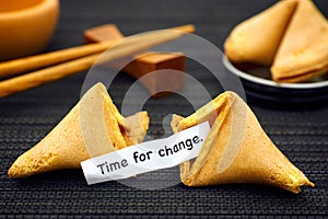 Paper strip with phrase Time fot Change from fortune cookie photo