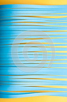 Paper strips background in blue and yellow