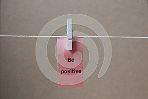 A paper tag `be positive` be positive concept background