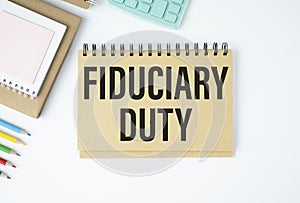 Paper with text fiduciary duty on wood