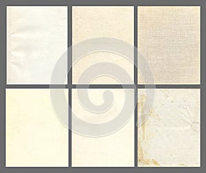 Paper and textile textures set. Blank old pages with rough faded surface