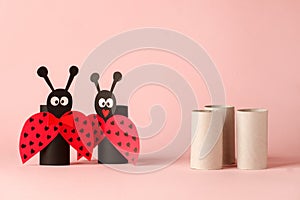 Paper toy ledybug for valentine romance baby shower, birthday party. Easy crafts for kids on pink background, copy space, die