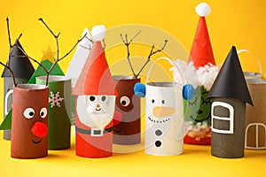 Paper toy Santa, Snowman, Grinch for Xmas party. Easy crafts for kids on yellow background, copy space, die creative idea from