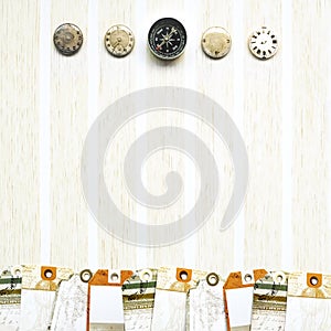 Paper travel tags, compass, clock