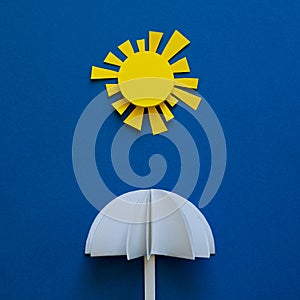 Paper umbrellas under sun. Origami. Sun protection and summer vacation concept