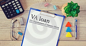 Paper with VA loan - U.S. Departament of Veterans Affairs on the table