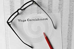 Paper with Wage Garnishment on a table