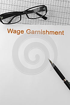 Paper with Wage Garnishment on a table