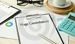 Paper with Wage Garnishment on a table photo