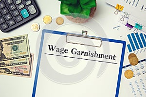 Paper with Wage Garnishment on the table photo