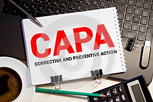 Paper with words CAPA Corrective and Preventive action plans