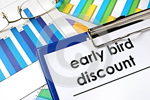 Paper with words Early bird discount. photo
