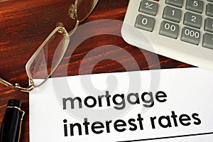 Paper with words mortgage interest rates. photo