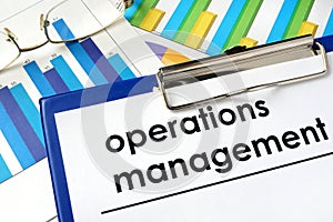 Paper with words operations management and charts.