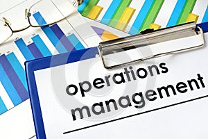 Paper with words operations management and charts. photo