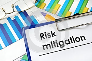 Paper with words Risk mitigation. photo